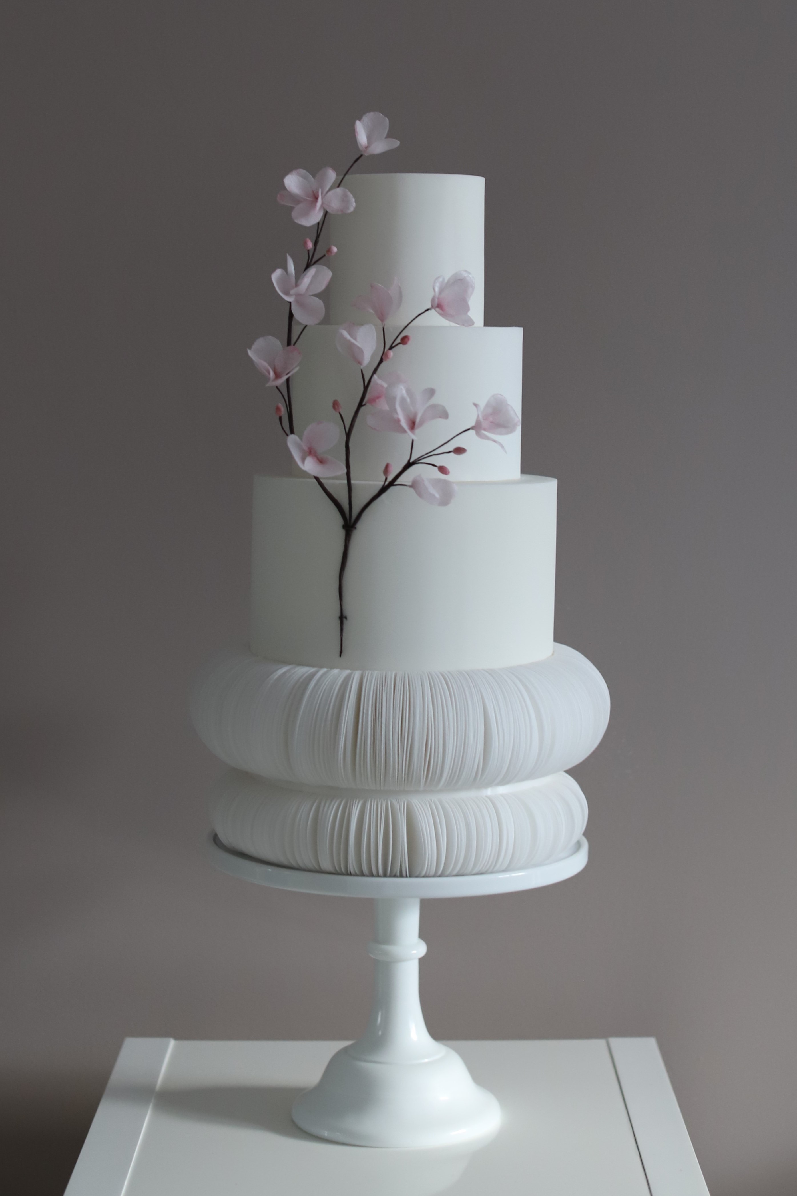 Luxury bespoke wedding cake with pink cherry blossom sugar flowers, West London cake designer