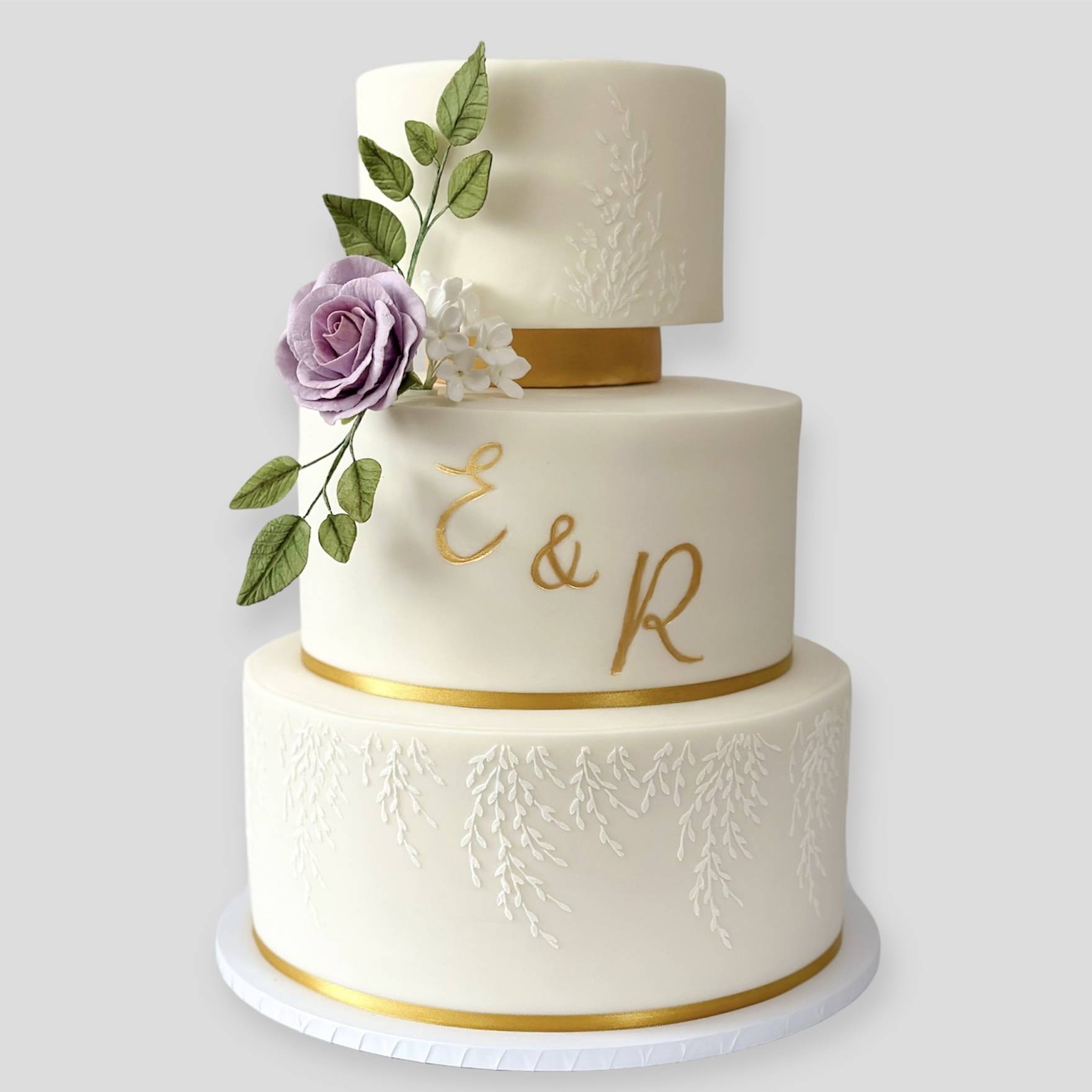 White and gold luxury wedding cake design by West London wedding cake designer
